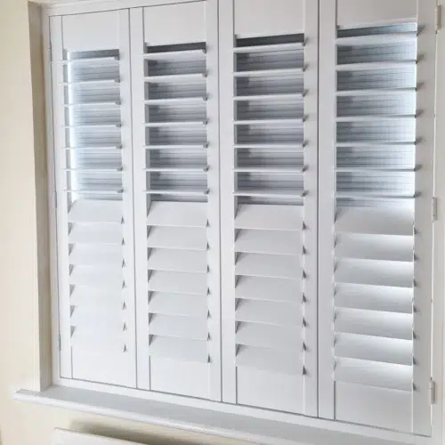 narrow panelled blackout shutters on sash windows