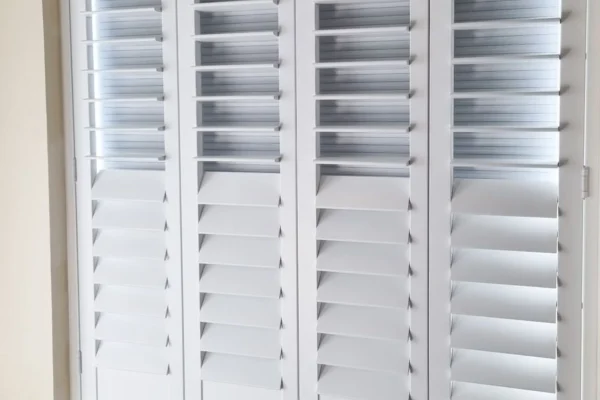 narrow panelled blackout shutters on sash windows