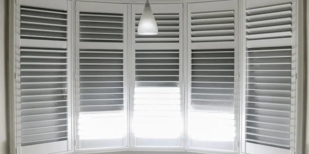 Blackout shutters on bay windows