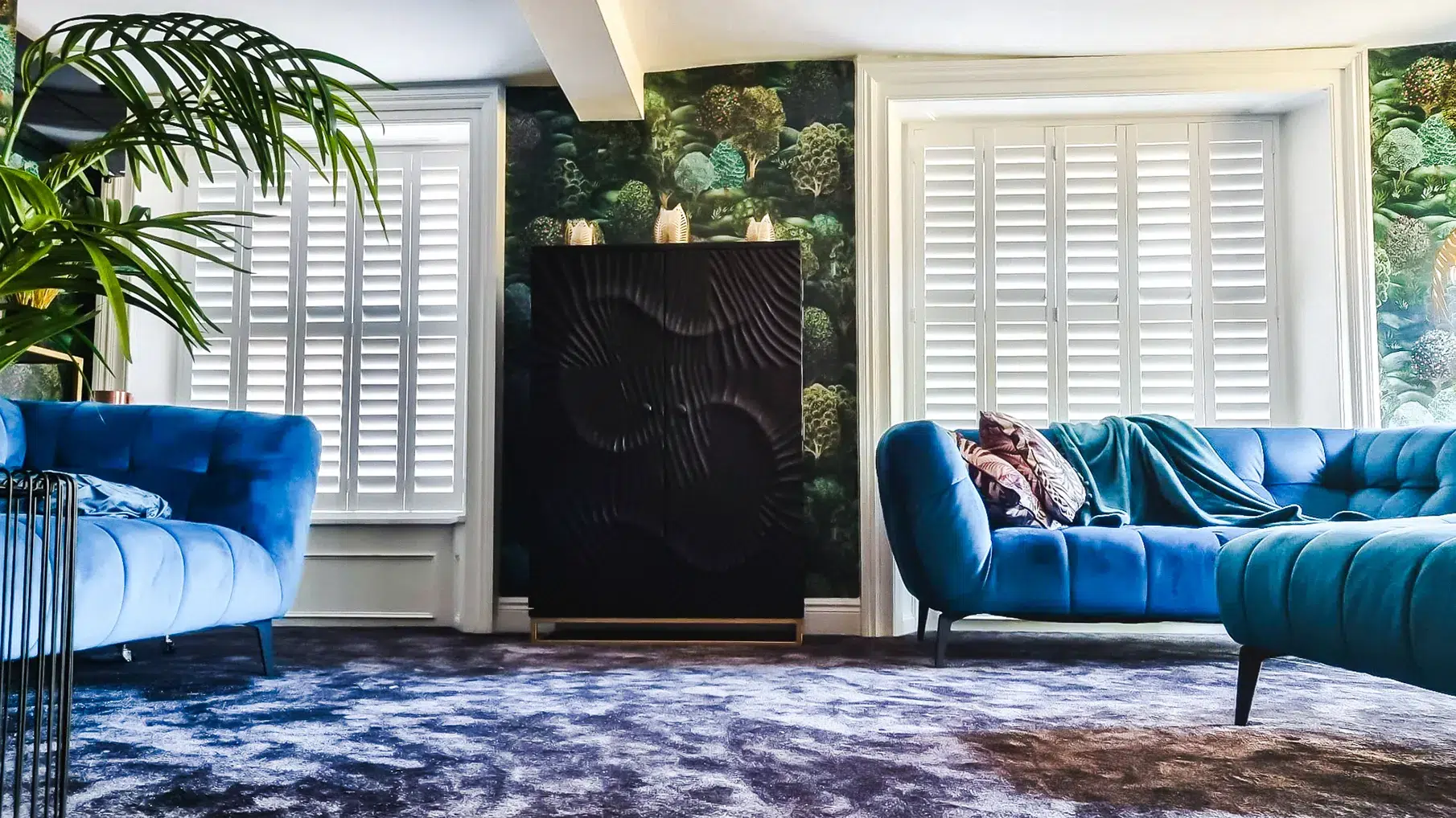 Tier on tier shutters on sash windows in stylish living room