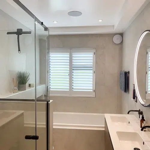 Stylish shutters in bathroom window