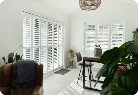 Stylish room with white window shutters
