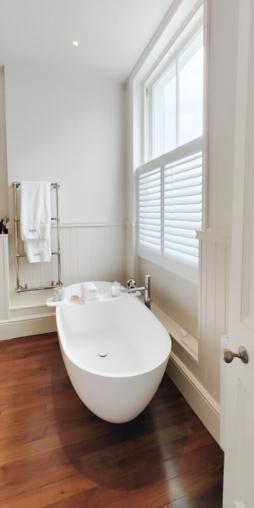 Cafe style shutters in bathroom