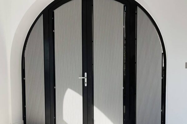 Shaped pleated blinds for doors