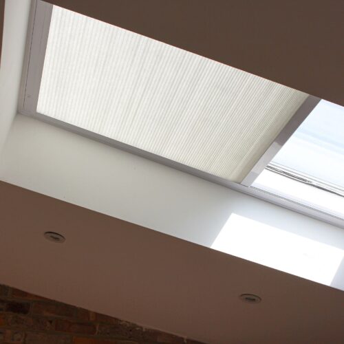 Electric pleated blinds for skylight windows